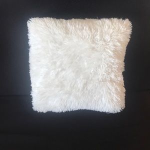 White fuzzy pillow